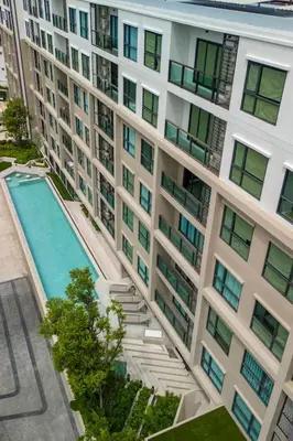 an overhead view of a large apartment building with a swimming pool at Modern apartment in the heart of Bangtao in Ban Thalat Choeng Thale
