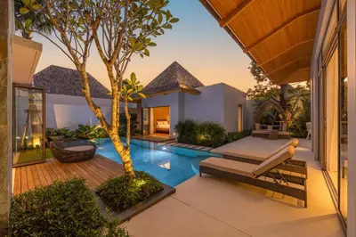 an external view of a villa with a swimming pool at Modern 3BR Villa Kaimana with Private Pool in Ban Phru Champa