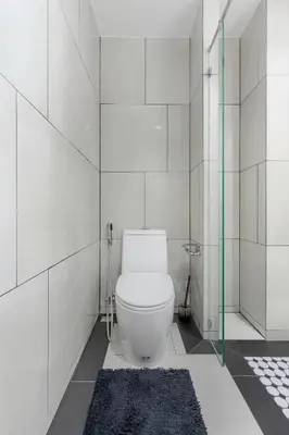 a white bathroom with a toilet and a shower at Studio with a terrace in The Title Legendary in Bang Tao Beach