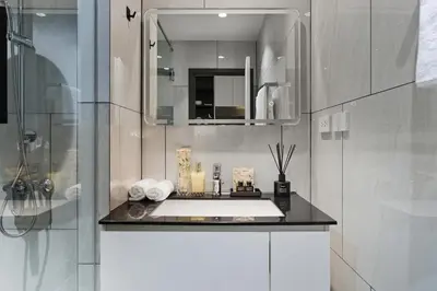 a bathroom with a sink and a mirror at Studio with a terrace in The Title Legendary in Bang Tao Beach