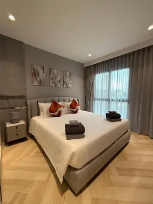 a bedroom with a large bed in a room at Title Legendary 2 bedroom in Bang Tao Beach