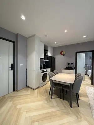 a kitchen and dining room with a table and chairs at Title Legendary 2 bedroom in Bang Tao Beach