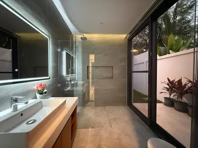 a bathroom with a sink and a mirror at Newly built private Quinta Lane 4br pool villa in Ban Saiyuan (1)