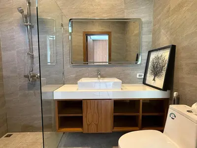 a bathroom with a sink and a mirror at Newly built private Quinta Lane 4br pool villa in Ban Saiyuan (1)