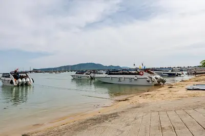 a group of boats are docked in the water at Villa Mayfair 4 bedrooms sea view with pool table in Ban Bang Chak