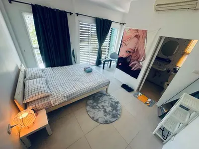an overhead view of a bedroom with a bed and a window at HulaFling Homestay in Ban Bo Han