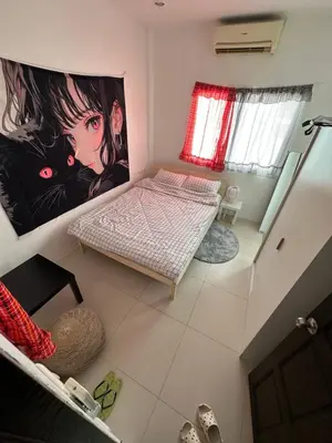 an overhead view of a bedroom with a bed in it at HulaFling Homestay in Ban Bo Han