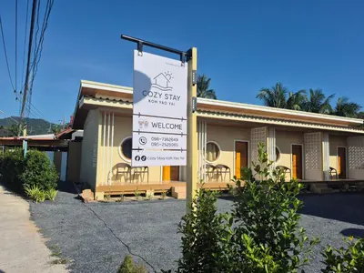a building with a sign in front of it at Cozy Stay Koh Yao Yai in Ko Yao Yai