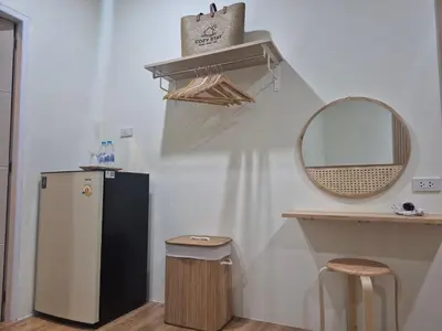 a kitchen with a refrigerator and a mirror at Cozy Stay Koh Yao Yai in Ko Yao Yai