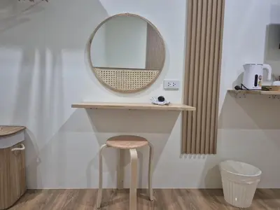 a dressing table with a stool and a mirror at Cozy Stay Koh Yao Yai in Ko Yao Yai