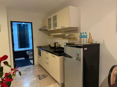 a small kitchen with a refrigerator and a sink at Phuket Rawai beachfront by Tris in Nai Harn Beach