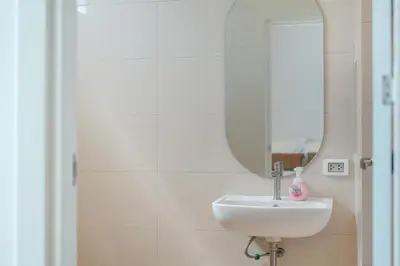 a bathroom with a sink and a mirror at Espuma Patong pool villa in Patong Beach