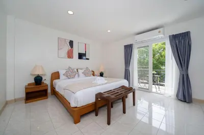 a bedroom with a bed and a large window at Suite dream villa Bangla Patong sleep 8 in Patong Beach