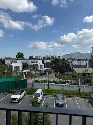 a view of a parking lot with cars parked at Sky Park Family Comfort in Laguna Phuket