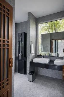 a bathroom with two sinks and a large mirror at Private Pool Villa Baan Bua in Phuket Town