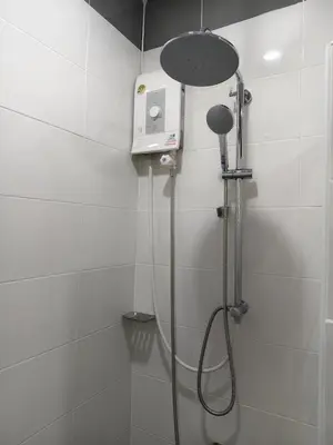 a shower with a shower head in a bathroom at The Blue Oasis Cozy Phuket Getaway in Ban Ket Ho