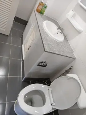 a small bathroom with a toilet and a sink at The Blue Oasis Cozy Phuket Getaway in Ban Ket Ho