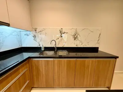 a kitchen with a sink and a marble counter top at Luxury 112 m 2BR, Direct Pool Access, 1st Line, Klong Muang Beach in Ban Ko Kwang