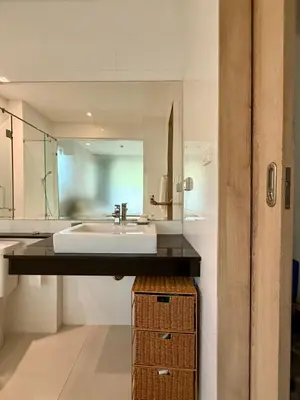 a bathroom with a sink and a mirror at Luxury 112 m 2BR, Direct Pool Access, 1st Line, Klong Muang Beach in Ban Ko Kwang
