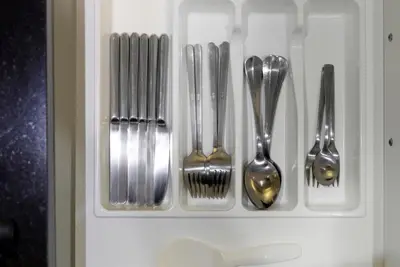 a group of silver utensils in a drawer at Onyx Villa by Beringela in Rawai Beach