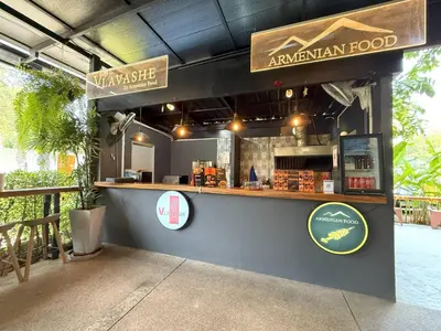 a food stand with a counter and signage at Apple House seaside home and pool in Ban Lum Fuang