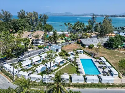 an aerial view of a resort with a swimming pool at Apple House Phuket a cozy home terrace &pool&beach in Ban Lum Fuang