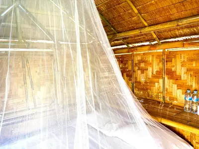 a wedding veil in a room with bottles of water at Patong Canal House 3 in Patong Beach