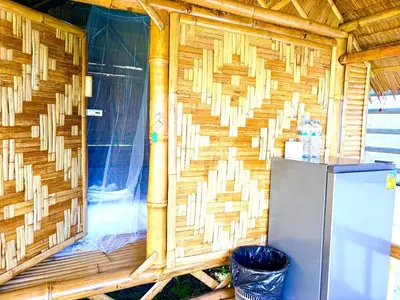 a wooden wall in a house with a refrigerator at Patong Canal House 3 in Patong Beach