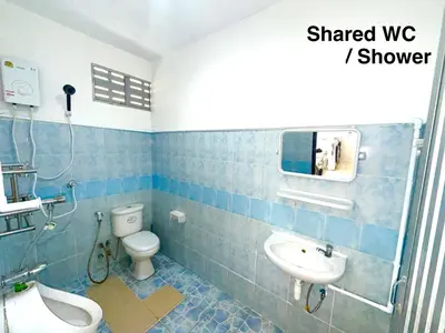 a bathroom with a white toilet and a sink at Patong Canal House 3 in Patong Beach