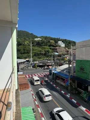 a view of a city with cars on a street at KataKeet in Kata Beach