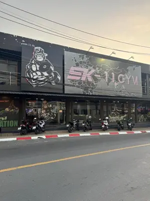 a group of motorcycles parked in front of a building at KataKeet in Kata Beach