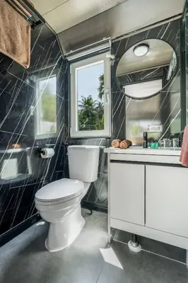 a bathroom with a toilet and a sink at Apple House Rental in Bangtao, pool and breakfast in Ban Lum Fuang