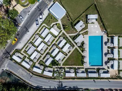 an overhead view of a building with a pool at Private Pool Apple House, Sea & Breakfast Bangtao in Ban Lum Fuang