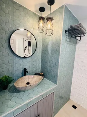 a bathroom with a sink and a mirror at Lahan 4 in Patong Beach
