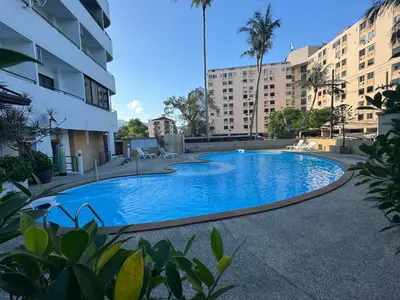 a swimming pool in the middle of a building at Lahan 4 in Patong Beach