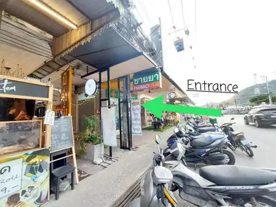 a group of motorcycles parked outside of a building at Fan Room Near Bangkok hospital Across Night market in Ban Ket Ho