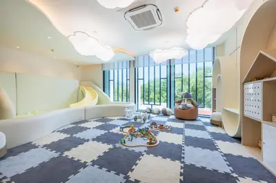 a childrens room with a checkered floor and large windows at Evora 1BR Suite — The Title Legendary BangTao in Bang Tao Beach