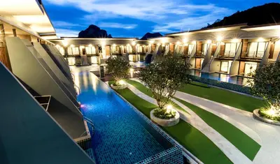 an overhead view of a hotel with a swimming pool at The Phu Beach Hotel - SHA Plus in Ao Nang Beach