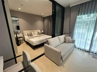 a living room with a bed and a couch at The Title Legendary Bang-Tao access to the pool in Bang Tao Beach