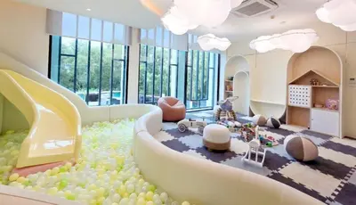 a living room with a bunch of balls on the floor at The Title Legendary Bang-Tao access to the pool in Bang Tao Beach