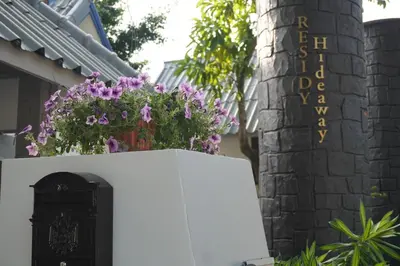 a white refrigerator with flowers on top of it at Residy Hideaway in Patong Beach