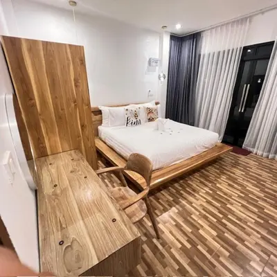 a room with a bed and a chair in it at Stingless Villa in Ban Ket Ho