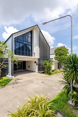 a large white building with a lot of windows at Sarah Place Private Tropical Villa in Ban Pak Lak