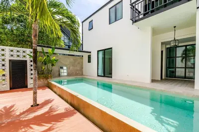 a swimming pool in the backyard of a house at Sarah Place Private Tropical Villa in Ban Pak Lak