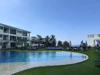 a swimming pool in the middle of a resort at Convenient apartment at Karon Butterfly by Lofty in Karon Beach