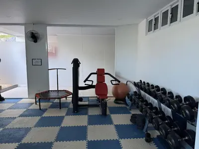 a room with a gym with a treadmill and chairs at Convenient apartment at Karon Butterfly by Lofty in Karon Beach