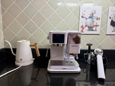 a white coffee maker sitting on a counter at Tropical Thai style 4 bedroom pool villa in Laguna Phuket