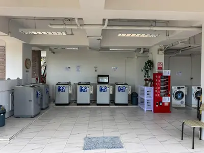 a room with a bunch of washing machines in it at Cozy 1 Bdr Royal Lee Nayang beach in Ban Bo Han