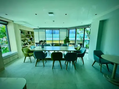 a dining room with a table and chairs at Family Space Condo 2 Bdr BangTao in Ban Thalat Choeng Thale