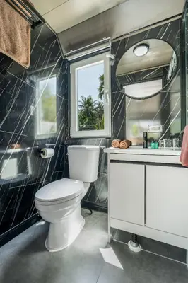 a bathroom with a toilet and a sink at Apple House Phuket Pool, Terrace, Breakfast, Beach in Ban Lum Fuang